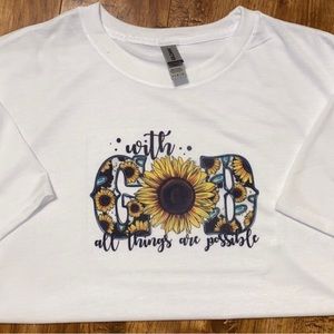 Large white t-shirt. “With god all things are possible”